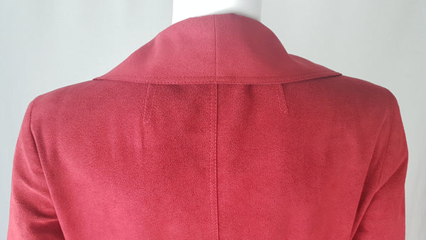 Back of collar detail on Vintage 1970's Halston Ultra Suede red knee length wrap coat dress with long sleeves, a wide collar, and a matching tie belt on a mannequin 