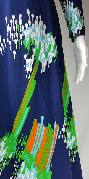 Detailed view of the navy stretch jersey and clustered green, aqua and white droplet print on a Lanvin maxi dress.