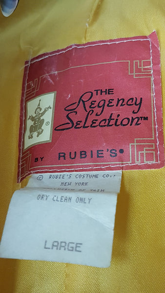 Close-up of the pink The Regency Selection by Rubie’s label with the dry-cleaning and size Large tags.