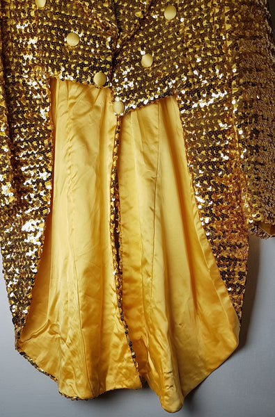 Interior view of the Rubie’s gold sequin tailcoat showing its warm gold satin lining, cutaway front and long lined tails.