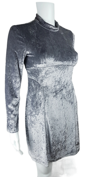 Silver grey crushed velvet mini dress with long sleeves, a high neckline, fitted silhouette, and curved seam detailing.