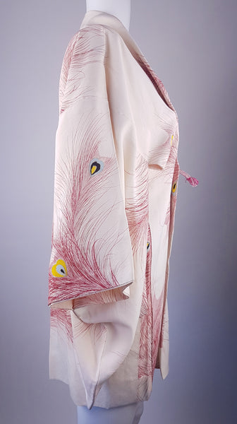 Vintage 1950s to 1960s Japanese haori on a mannequin, featuring red peacock feather motifs with blue, yellow, black and metallic gold details - sideview