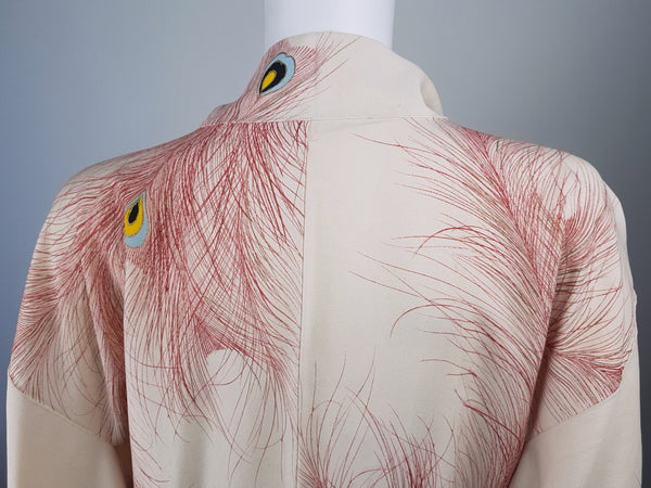 Vintage 1950s to 1960s Japanese haori on a mannequin, featuring red peacock feather motifs with blue, yellow, black and metallic gold details - back view, closeup of shoulders and collar