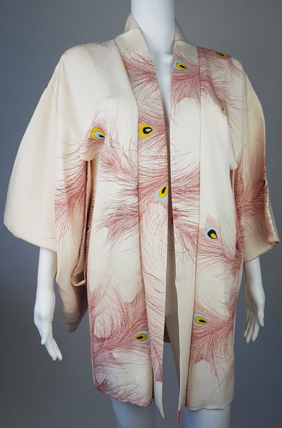 Vintage 1950s to 1960s Japanese haori on a mannequin, featuring red peacock feather motifs with blue, yellow, black and metallic gold details - front view