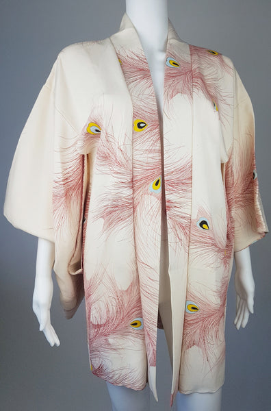 Vintage 1950s to 1960s Japanese haori on a mannequin, featuring red peacock feather motifs with blue, yellow, black and metallic gold details - front view