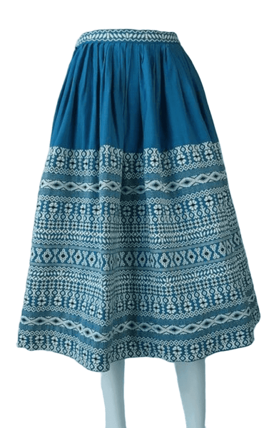 Vintage 1950s Mayan Modern Guatemalan cotton skirt in rich blue and white with traditional geometric woven motifs displayed on a mannequin - front view