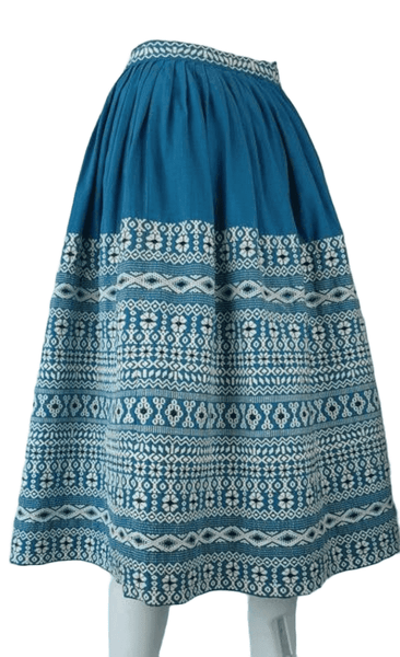 Vintage 1950s Mayan Modern Guatemalan cotton skirt in rich blue and white with traditional geometric woven motifs displayed on a mannequin - front side view