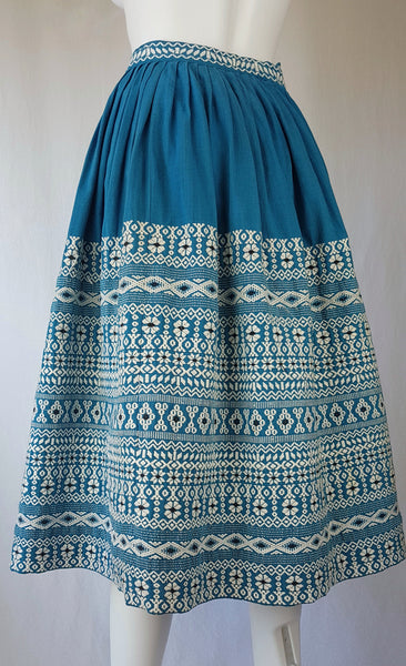 Vintage 1950s Mayan Modern Guatemalan cotton skirt in rich blue and white with traditional geometric woven motifs displayed on a mannequin - front view