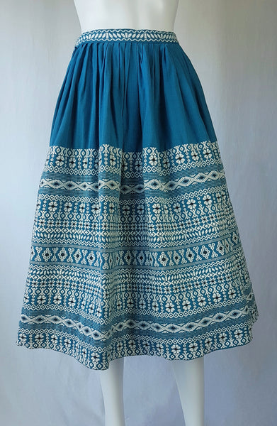 Vintage 1950s Mayan Modern Guatemalan cotton skirt in rich blue and white with traditional geometric woven motifs displayed on a mannequin - front view