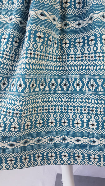 Vintage 1950s Mayan Modern Guatemalan cotton skirt in rich blue and white with traditional geometric woven motifs displayed on a mannequin - detailed motif view