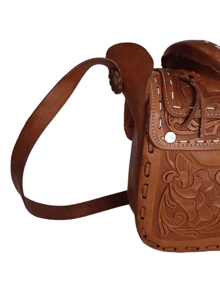 Strap view of a vintage 1960s Mexican tooled-leather crossbody bag constructed as a miniature Western horse saddle 