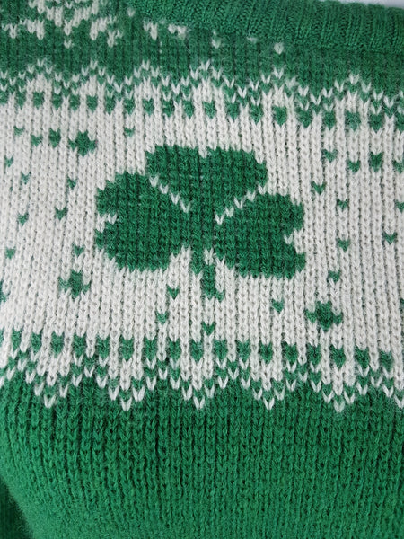 Vintage 1970s - 1980s Blarney Castle Irish fisherman’s green wool sweater with white shamrock and patterns on a mannequin