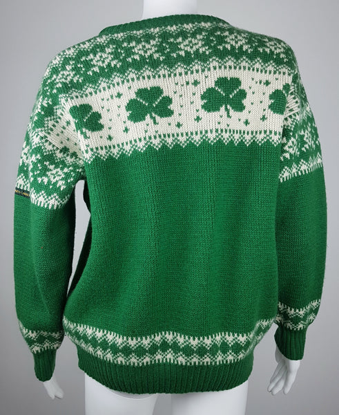 Vintage 1970s - 1980s Blarney Castle Irish fisherman’s green wool sweater with white shamrock and patterns on a mannequin
