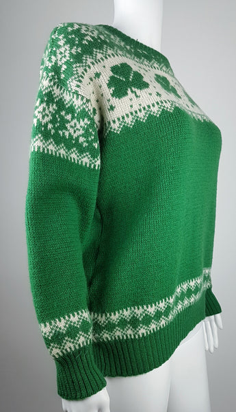 Vintage 1970s - 1980s Blarney Castle Irish fisherman’s green wool sweater with white shamrock and patterns on a mannequin