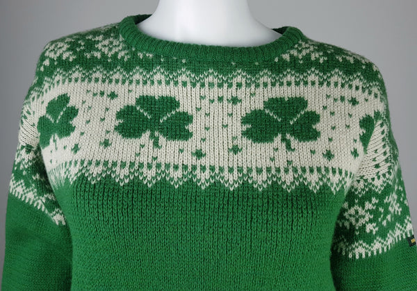 Vintage 1970s - 1980s Blarney Castle Irish fisherman’s green wool sweater with white shamrock and patterns on a mannequin