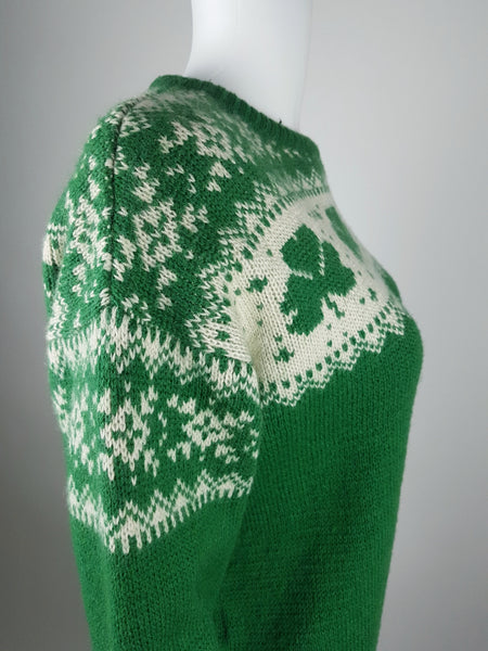 Vintage 1970s - 1980s Blarney Castle Irish fisherman’s green wool sweater with white shamrock and patterns on a mannequin