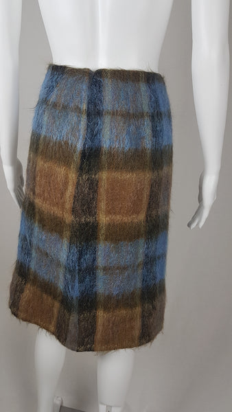 Vintage 1970s Andrew Stewart mohair and wool pencil skirt with a fuzzy plaid pattern in blue, brown, grey, and olive shown on mannequin