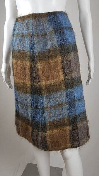 Vintage 1970s Andrew Stewart mohair and wool pencil skirt with a fuzzy plaid pattern in blue, brown, grey, and olive shown on mannequin