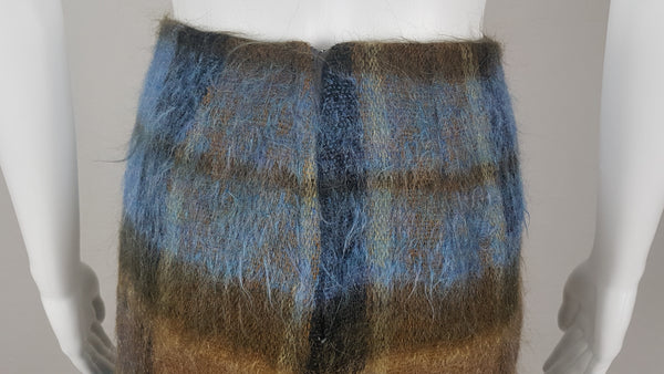 Vintage 1970s Andrew Stewart mohair and wool pencil skirt with a fuzzy plaid pattern in blue, brown, grey, and olive shown on mannequin