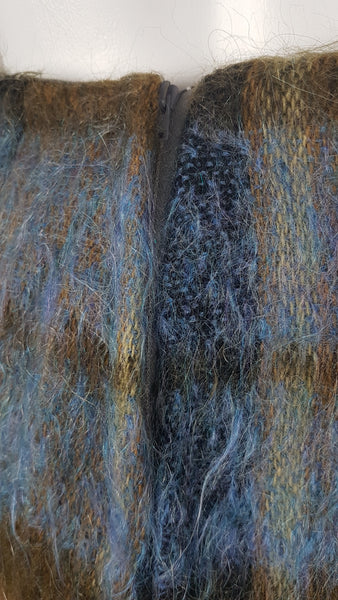 Vintage 1970s Andrew Stewart mohair and wool pencil skirt with a fuzzy plaid pattern in blue, brown, grey, and olive shown on mannequin