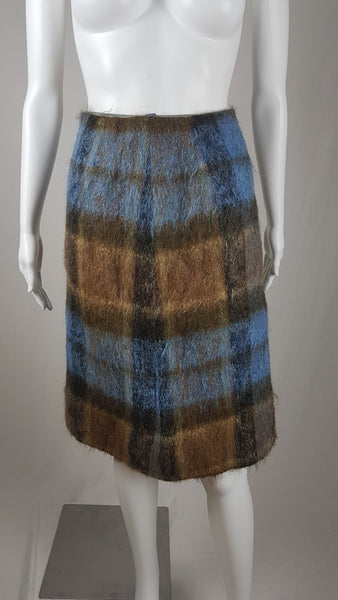 Vintage 1970s Andrew Stewart mohair and wool pencil skirt with a fuzzy plaid pattern in blue, brown, grey, and olive shown on mannequin
