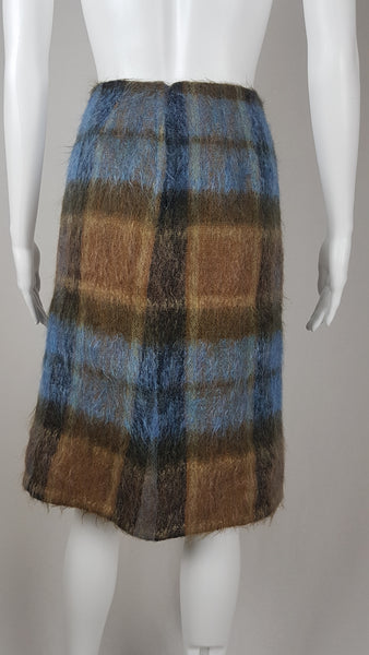 Vintage 1970s Andrew Stewart mohair and wool pencil skirt with a fuzzy plaid pattern in blue, brown, grey, and olive shown on mannequin