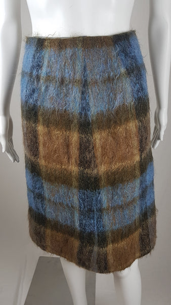 Vintage 1970s Andrew Stewart mohair and wool pencil skirt with a fuzzy plaid pattern in blue, brown, grey, and olive shown on mannequin