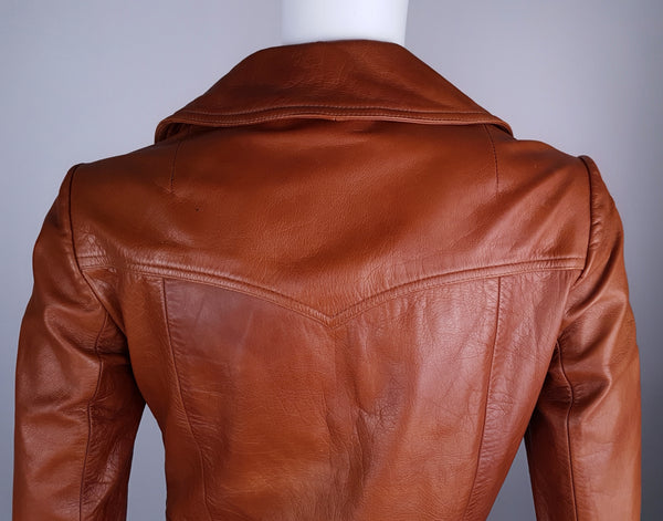 Close-up of the back collar, shoulder panel and curved seams shaping the rear of the jacket