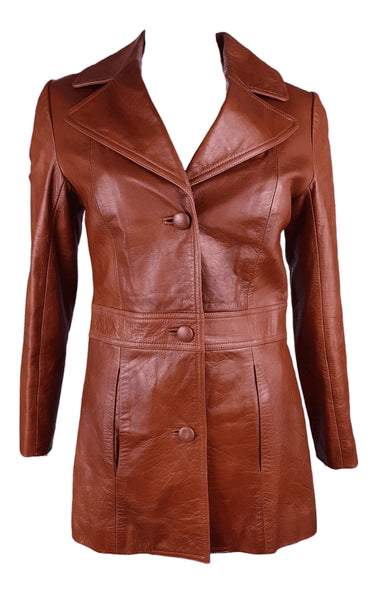 Front view of a fitted 1970s cognac leather jacket with a wide notched collar, covered buttons and welt pockets