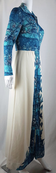 Vintage 1970s Missy House of Canada maxi dress with an aqua blue patterned bodice, long sleeves, pointed collar, and a white skirt with coordinating abstract panels shown on a mannequin
