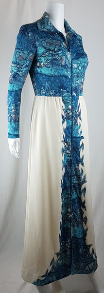 Vintage 1970s Missy House of Canada maxi dress with an aqua blue patterned bodice, long sleeves, pointed collar, and a white skirt with coordinating abstract panels shown on a mannequin