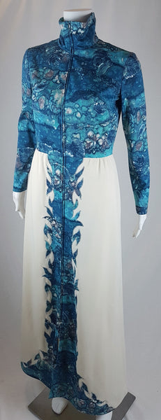 Vintage 1970s Missy House of Canada maxi dress with an aqua blue patterned bodice, long sleeves, pointed collar, and a white skirt with coordinating abstract panels shown on a mannequin