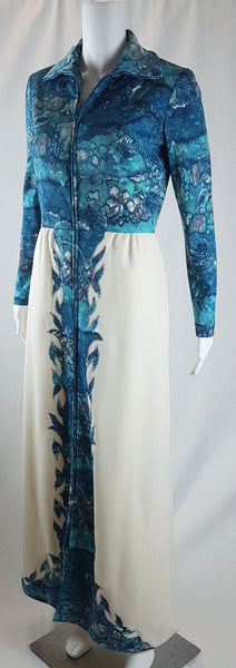 Vintage 1970s Missy House of Canada maxi dress with an aqua blue patterned bodice, long sleeves, pointed collar, and a white skirt with coordinating abstract panels shown on a mannequin