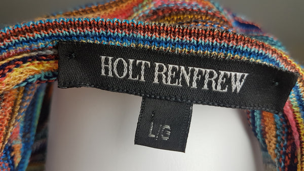 Close-up of the black Holt Renfrew label and size tag marked L/G inside the vintage knit top