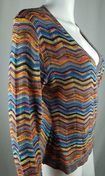 Three-quarter side view of a vintage 1990s Holt Renfrew multicolour knit top showing its deep neckline.