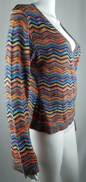 Three-quarter side view of a vintage 1990s Holt Renfrew multicolour knit top showing its deep neckline.