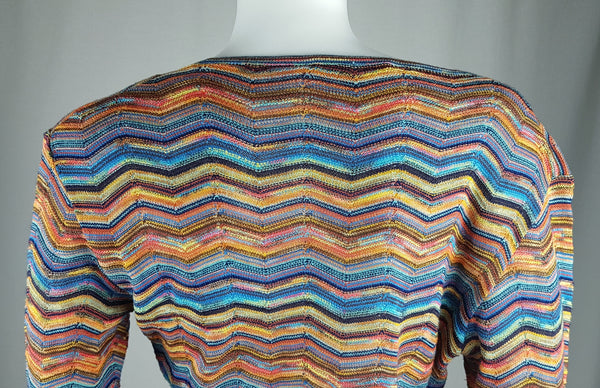 Close-up back view showing the wide neckline, shoulder seams and multicolour chevron pattern of a vintage 1990s Holt Renfrew knit top.