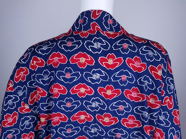 Vintage hand-stitched full-length Japanese cotton kimono displayed on a mannequin, with a bold blue, red and white lotus flower print - Back shoulder and collar view