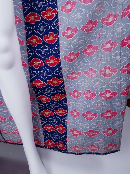 Closeup of inner fabric and stitching of Vintage hand-stitched full-length Japanese cotton kimono, with a bold blue, red and white lotus flower print 