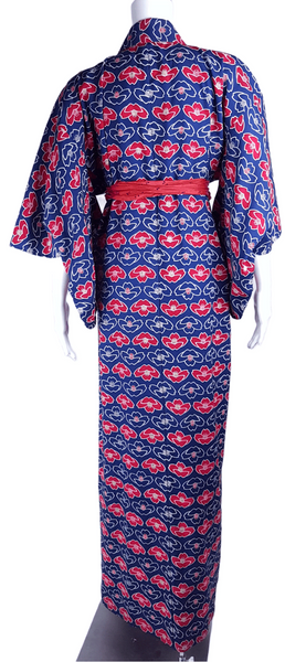 Vintage hand-stitched full-length Japanese cotton kimono displayed on a mannequin, with a bold blue, red and white lotus flower print - back view