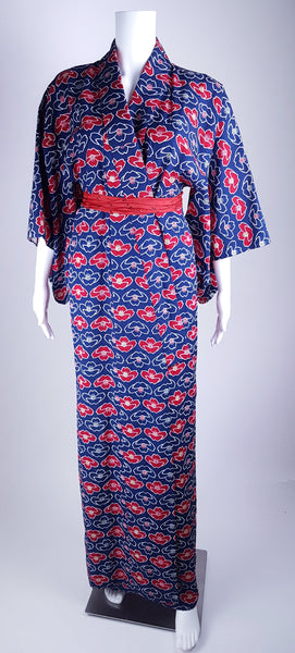 Vintage hand-stitched full-length Japanese cotton kimono displayed on a mannequin, with a bold blue, red and white lotus flower print - front view