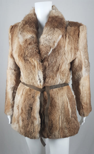 Vintage late 1980s to early 1990s brown rabbit fur jacket on a mannequin with a wide collar and leather tie belt - front view