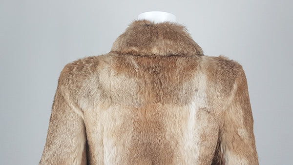 Vintage late 1980s to early 1990s brown rabbit fur jacket on a mannequin with a wide collar without the leather tie belt - back collar and shoulders view
