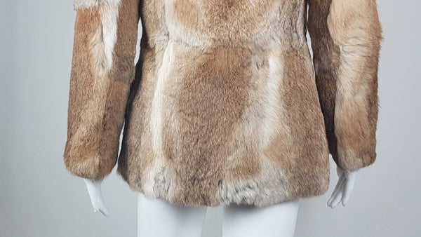 Vintage late 1980s to early 1990s brown rabbit fur jacket on a mannequin with a wide collar without the leather tie belt - back view