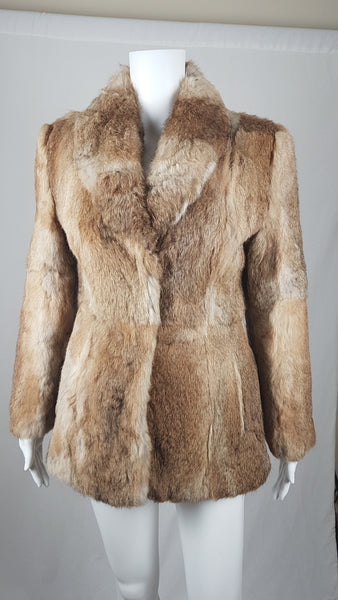 Vintage late 1980s to early 1990s brown rabbit fur jacket on a mannequin with a wide collar without the leather tie belt - front view