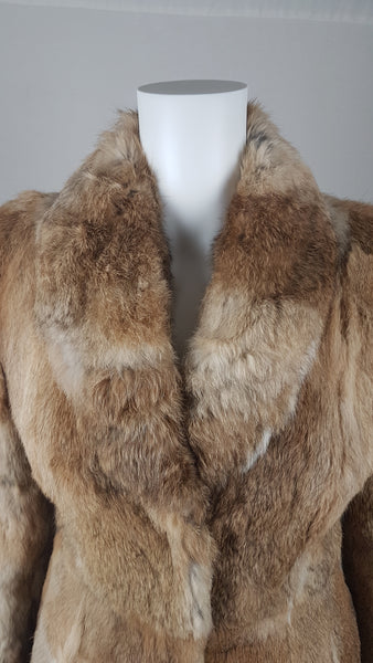 Close-up of a vintage  late 1980s to early 1990s brown rabbit fur jacket on a mannequin, showing the lapel and plush collar and natural tonal variations - front view