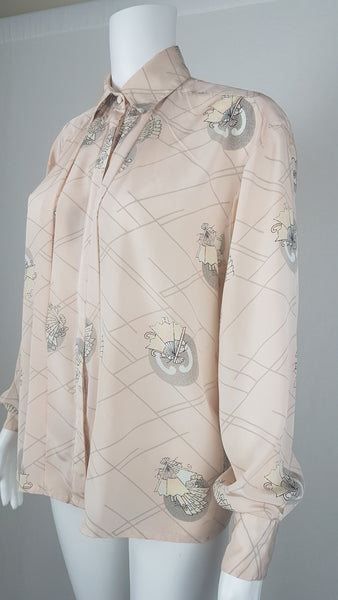 Vintage 1980s pastel peach Jac Dale shirt with long sleeves, a pointed collar, and an abstract grey fan print on a mannequin